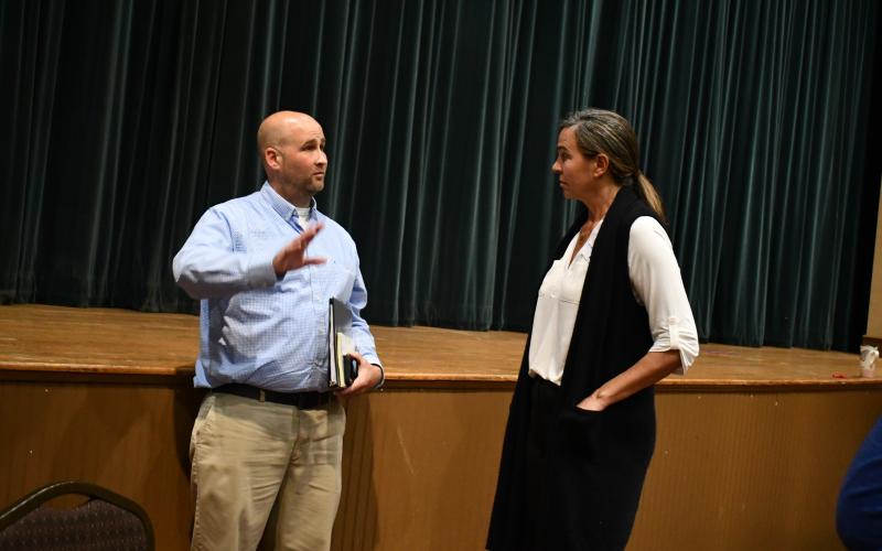 Megan Horn/The Clayton Tribune. Clayton City Council candidates Andrew Green and Sarah Gillespie converse after the candidate debate Oct. 11.