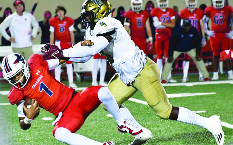 Wade Cheek/The Clayton Tribune. “Tank” Carrington earns his second sack against Providence Day.