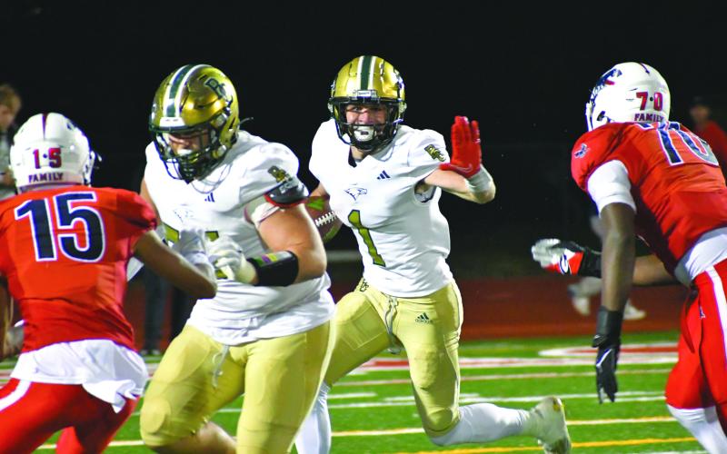 Wade Cheek/The Clayton Tribune. Eagle senior and Georgia Tech commit Trey Horne splits the trenches in an attempt to add on to his five-score game in last Friday’s win.