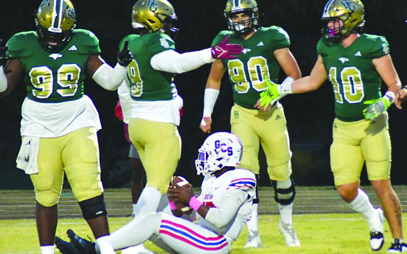 Enoch Autry/The Clayton Tribune.  RGNS’s Ezra Burress (10) celebrates one of the team’s total 11 sacks of Greenville Christian’s QB Jaylen Bester with teammates Terry Nwabuisi-ezeala, Tank Carrington and Hector Gonzaleza.