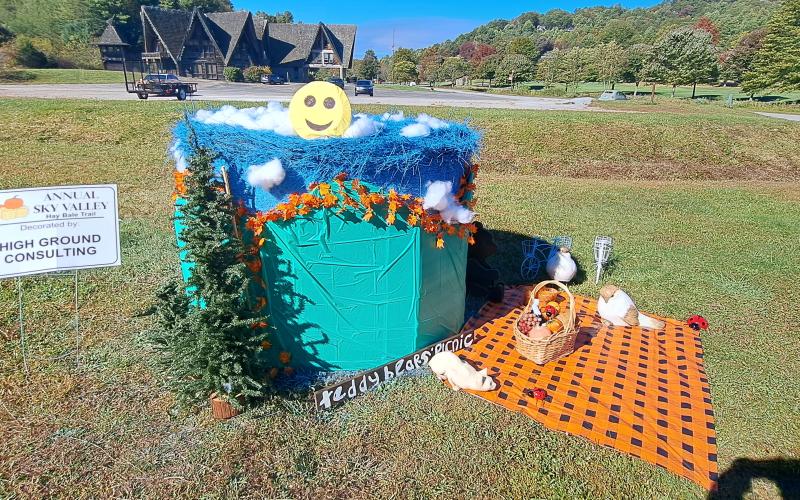Megan Horn/The Clayton Tribune. Check out the High Ground Consulting bale in the Sky Valley Hay Bale Trail. Left: Noryce and Don Burgey decorate a bale in the Sky Valley Hay Bale Trail for Bartram Trail Conservancy to bring awareness to and promote the 110-mile trail.