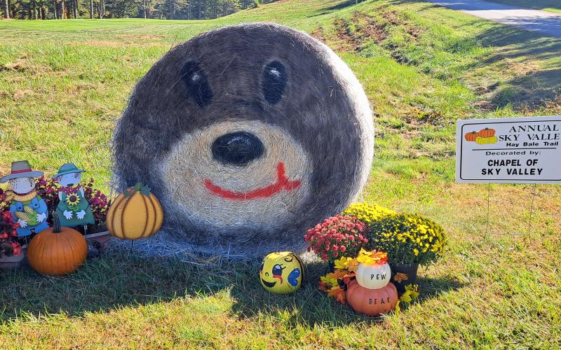 Megan Horn/The Clayton Tribune. Chapel of Sky Valley decorates for the Sky Valley Hay Bale Trail. Left: Noryce and Don Burgey decorate a bale in the Sky Valley Hay Bale Trail for Bartram Trail Conservancy to bring awareness to and promote the 110-mile trail.