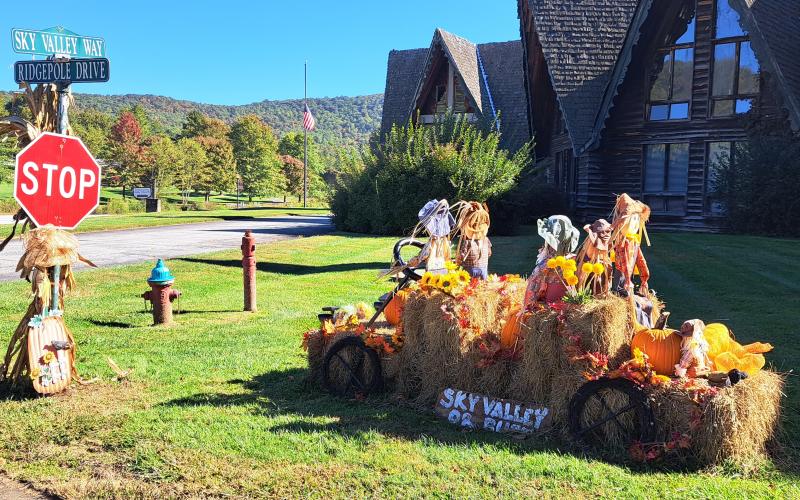 Megan Horn/The Clayton Tribune. Sky Valley citizens say “Sky Valley or Bust” as the city is decorated in preparation for the Sky Valley Fall Festival on Saturday, October 21. Left: Noryce and Don Burgey decorate a bale in the Sky Valley Hay Bale Trail for Bartram Trail Conservancy to bring awareness to and promote the 110-mile trail.