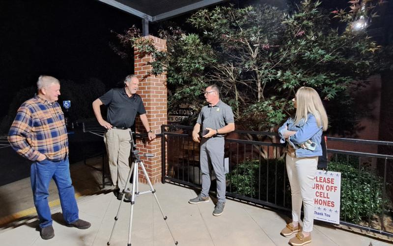 Megan Horn/The Clayton Tribune. Several Rabun Countians showed up at the elections office Tuesday evening to find out the Nov. 7 race results. Pictured are City of Tiger Mayor Mike Carnes, left, outgoing Clayton council member John Bradshaw, incoming Clayton council member Stacy L. Fountain and Clayton City Council Member Amanda Harrold.