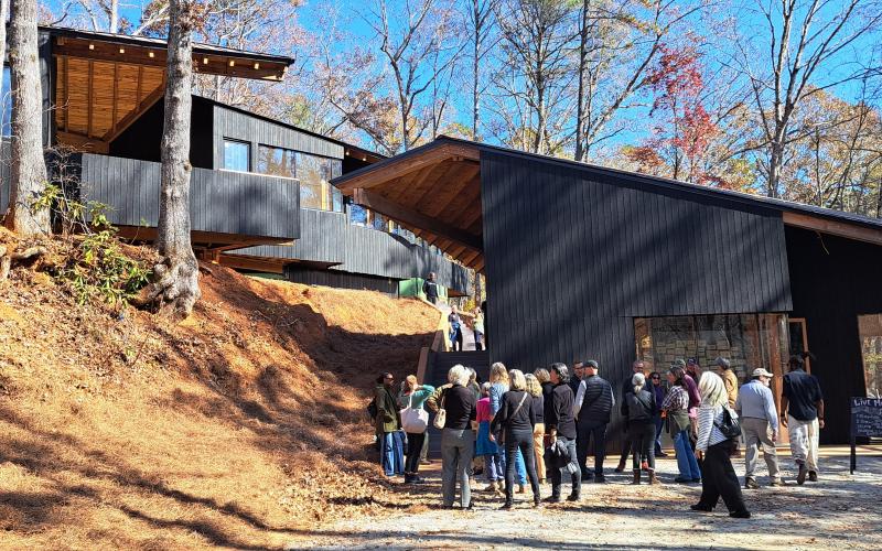 Megan Horn/The Clayton Tribune. Community members showed out to the Hambidge Center in Rabun Gap Nov. 4 for the open house for the new Antinori Village Saturday, Nov. 4. The campus was open with tours of the Antinori Village and workshop spaces, with live music, resident artist studio tours, delicious food and other fun activities. Left: Photo courtesy Forward Rabun/Rabun County Chamber of Commerce. Forward Rabun/Rabun County Chamber of Commerce congratulated the Hambidge Center on their ribbon cutting.