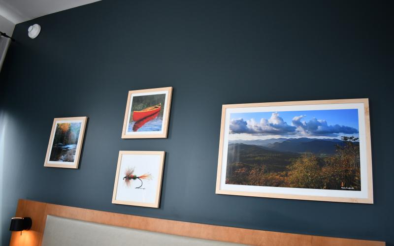 Megan Horn/The Clayton Tribune. Local artists Broderick and Michele Crawford of the Main Street Crawford Art Gallery have their photographs and paintings displayed in all 45 rooms of the Bridge Creek Inn, 210 pieces with three lobby pieces.