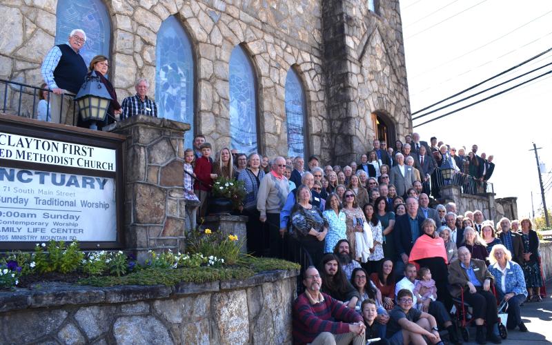 Submitted photo. Members of the Clayton First United Methodist Church gather outside the church on South Main Street in Clayton for a photograph at the 100th anniversary event. Below: Clayton Mayor Kurt Cannon (left) presents a framed proclamation to the church.