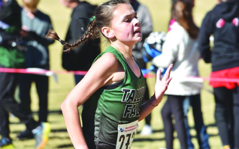 TFS Athletics. TFS freshman Avery Keim sprints to the finish line at the state meet.