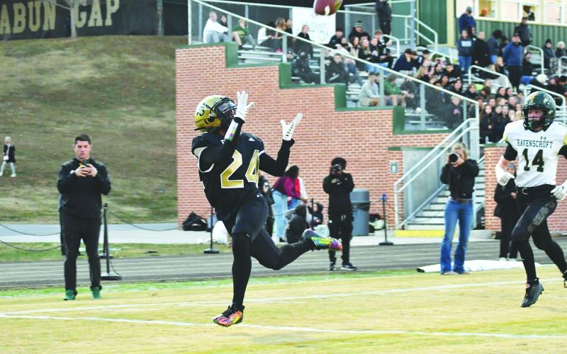 Wade Cheek/The Clayton Tribune. RGNS wide receiver Natey Fom cradles in a wide-open touchdown catch to extend the Eagles lead in last Friday’s first round of the tourney.