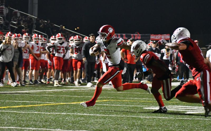 Wade Cheek/The Clayton Tribune. RCHS sophomore quarterback Ty Truelove breaks away from Social Circle in the first round of the state playoffs on Nov. 10 in the Wildcats’ 46-17 win. Rabun County plays at Whitefield Academy Friday night.