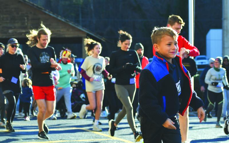 Wade Cheek/The Clayton Tribune. Participants of the 2023 Clayton Turkey Trot hit the ground running at the start of last Thursday’s race.