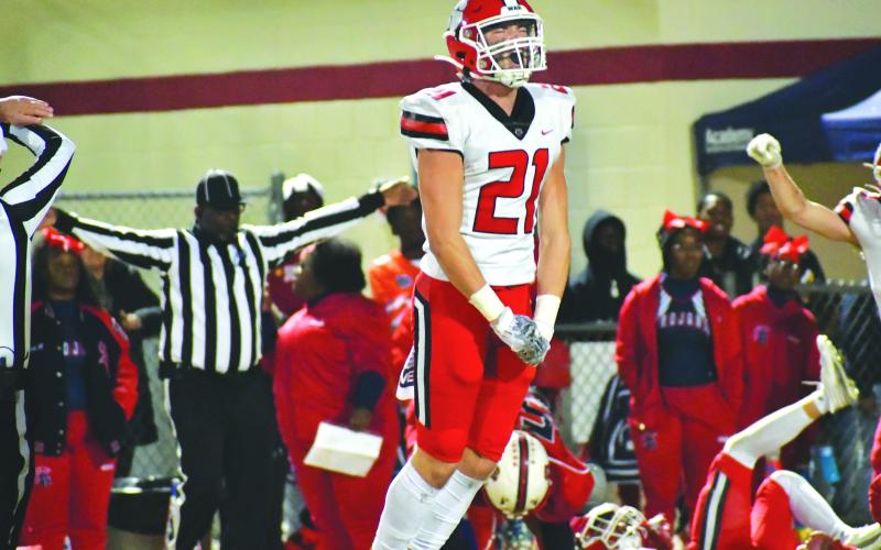 Wade Cheek/The Clayton Tribune. RCHS senior Paul Picciotti reacts to his Wildcats making a defensive stop in the quarterfinals against Brooks County.