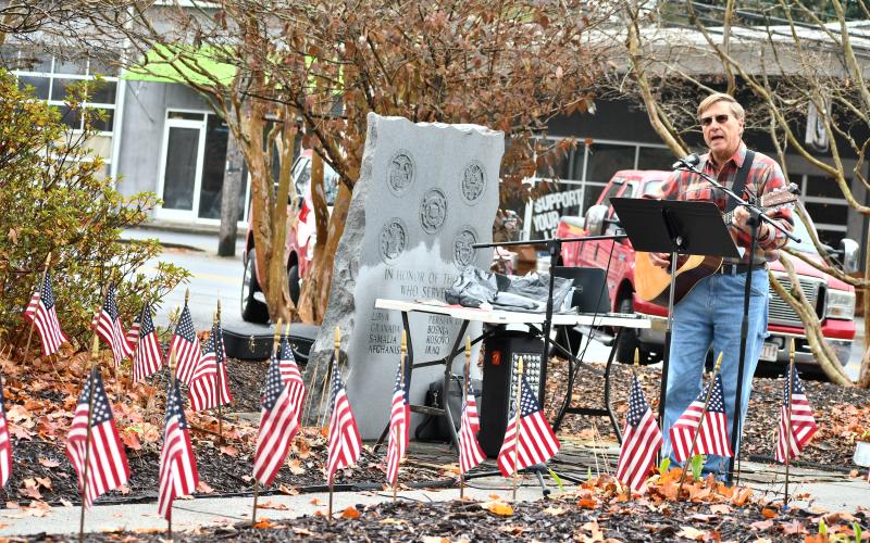 Megan Horn/The Clayton Tribune. Greg Funkhouser honored veterans through song as he performed his original song “Thank You For Answering The Call.”