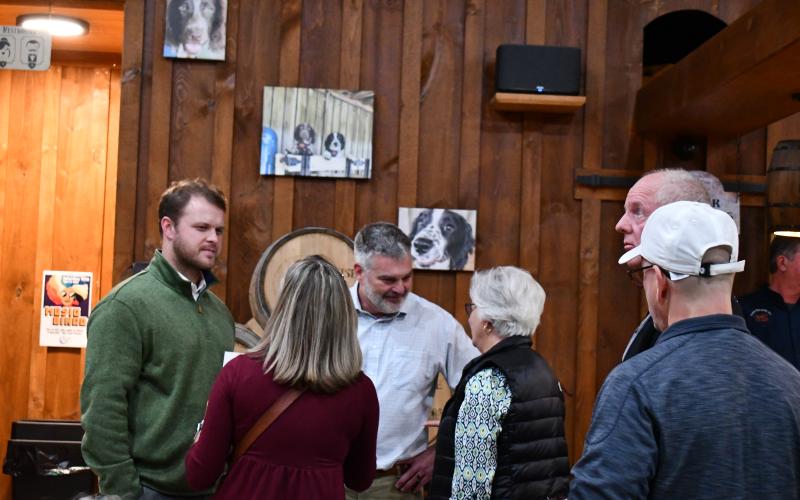 Megan Horn/The Clayton Tribune. Sen. Bo Hatchett and Rep. Victor Anderson speak with citizens at Moonrise Distillery during a Town Hall meeting Monday, Nov. 13.
