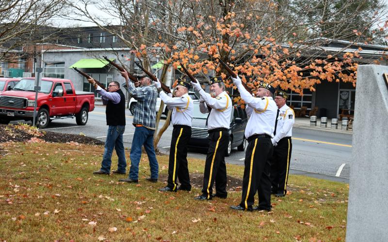Megan Horn/The Clayton Tribune. The Honor Guard gave a Three-Volley Salute and then performed Taps.