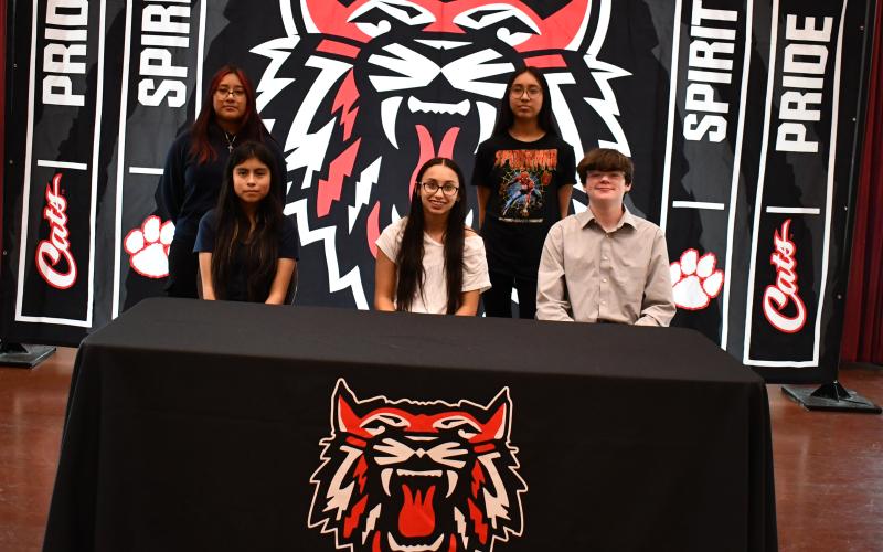 Megan Horn/The Clayton Tribune. During a special signing ceremony Nov. 16, five students at Rabun County Schools committed to a REACH Georgia Scholarship program for the opportunity to obtain $10,000 in college scholarships. Pictured are 2023-2024 REACH Scholars Maeli Chastain, Melina Hernandez, Naomi Lopez Ramirez, Saray Rodriquez and Caden Watts.