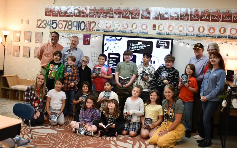 Megan Horn/The Clayton Tribune. Third graders at Rabun County Elementary School receive dictionaries from Rotary members.