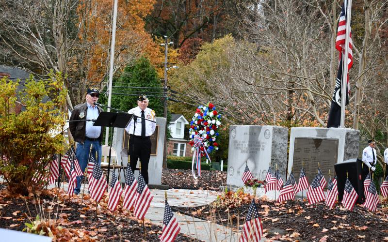 Megan Horn/The Clayton Tribune. Retired U.S. Air Force Major Buzzy Frysinger was the guest speaker at the Nov. 11 Veterans Day Ceremony held at Veterans Park. Frysinger is a retired command pilot with over 10,000 hours of flying time. He served in Vietnam, The Cold War, and Desert Storm. Frysinger currently lives in Tiger. In the background is SVCDR Doug Wayne, D.A.V.CH. 15.