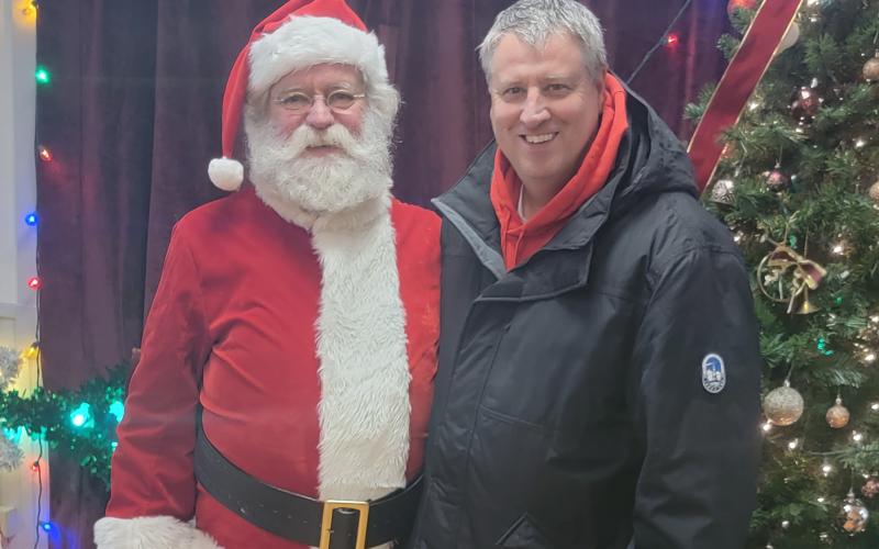 Enoch Autry/The Clayton Tribune. Santa Claus came to Dillard for the city’s Christmas tree lighting ceremony. Here St. Nick visits with Dillard Mayor Claude Dillard.