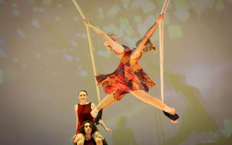 Photography submitted. Abby Hartridge ’26 of Clayton, and Monna  Julkunen ’24 of Finland perform in “Cirque Synthethica’s” final number on the trapeze. Pictured in back, are MaKenna Bilbery ’26 of Otto, N.C., and Cyrus Manoogian ’24 of Rabun Gap during the school’s October performance.