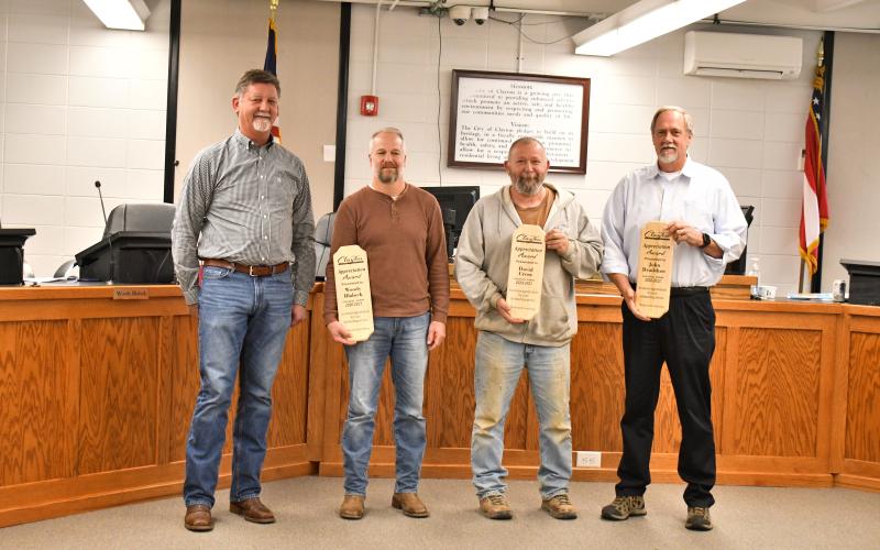 Megan Horn/The Clayton Tribune. Clayton Mayor Kurt Cannon recognizes outgoing council members Woody Blalock, David Cross and John Bradshaw for their years of service to the city. The three council members were presented with awards during Tuesday’s meeting and honored with a community reception.