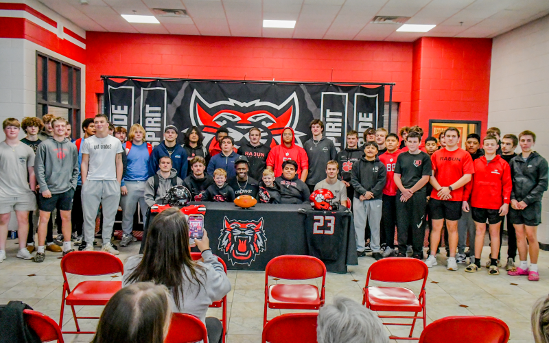 Wade Cheek/The Clayton Tribune. Seated in the center, senior Willie Goodwyn poses for a photograph with his Rabun County Wildcat football teammates and others Monday.