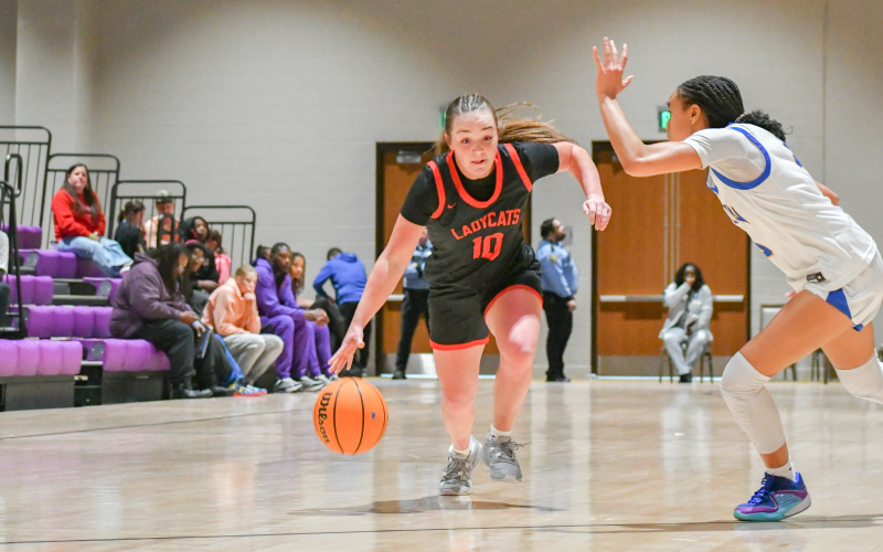 Wade Cheek/The Clayton Tribune. Lady Cat guard Mili Watts drives towards the paint, drawing a shooting foul during RCHS’s Dec. 21 loss to Wren High School. Despite scoring just three points in the first quarter, the Lady Cats scored 49 over the next three, outscoring the No. 10 team in South Carolina.