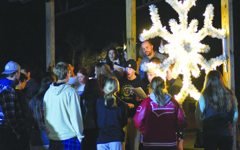 Enoch Autry/The Clayton Tribune. The community enjoys caroling from students from Head of Tennessee Baptist Church during the Dillard Tree Lighting Ceremony.