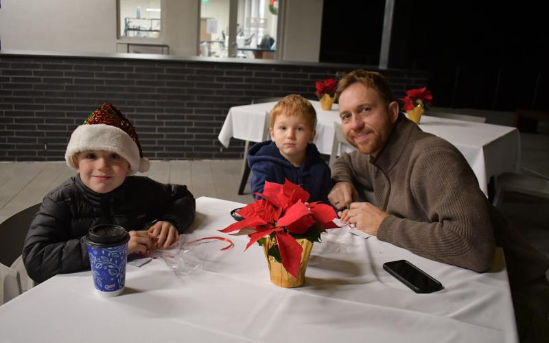 Megan Horn/The Clayton Tribune. Torsten, Elias, 6, and Amundsen Ernst, 4, enjoy seeing Santa at Mountain Lakes Medical Center Dec. 14.