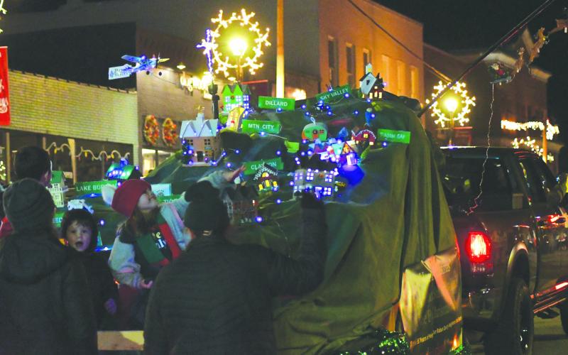 Enoch Autry/The Clayton Tribune.  The float with the “Best Theme” for this year’s “I’ll Be Home For Christmas” was awarded to Poss Realty. On the Poss Realty float, a map of Rabun County was shown with its municipalities and other residential spots of Clayton, Dillard, Lakemont, Lake Burton, Lake Rabun, Mountain City, Rabun Gap, Seed Lake, Sky Valley, Tallulah Falls, Tiger and Wiley.