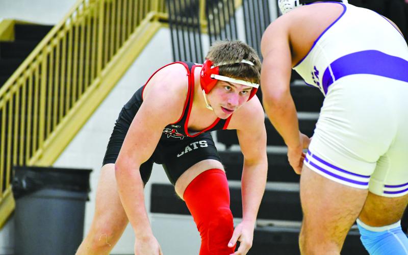 Wade Cheek/The Clayton Tribune. RCHS grappler Celton Littrell sizes up his Athens Christian opponent during last weekend’s area duals match on Jan. 13. The 175-pounder won the match, helping the Wildcats go 2-2 throughout the day after defeating the Eagles and area opponent Towns County.