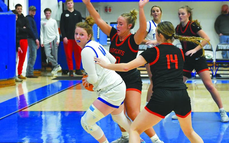 Wade Cheek/The Clayton Tribune. Ellie Southards and Jacie McCall apply heavy pressure to a Town’s County forward during the Lady Cats Dec. 29 win over the Lady Indians.