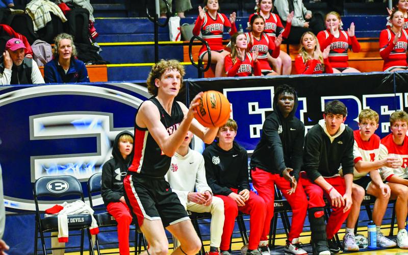 Wade Cheek/The Clayton Tribune. Wildcat Hayes Free lines up his shot against Elbert County.
