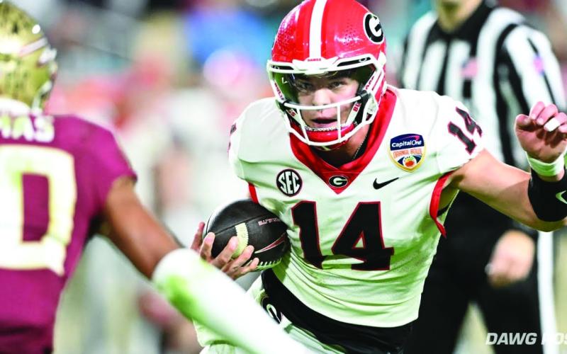Dawg Post. Current Bulldog and former Rabun County star quarterback, Gunner Stockton, weaves his way through Hard Rock Stadium in Miami during the Orange Bowl. The redshirt freshman threw for 96 yards and two TDs.