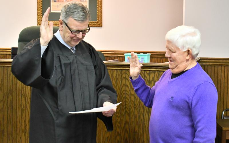 Megan Horn/The Clayton Tribune. Probate Judge Carlton Hobie Jones, III swears in Board Member Jimmy Bleckley.