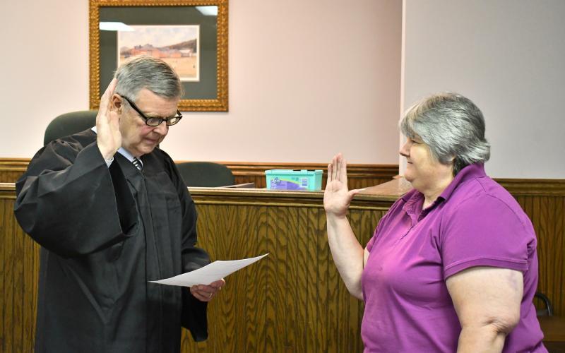 Megan Horn/The Clayton Tribune. Probate Judge Carlton Hobie Jones, III swears in Elections and Voter Registration Director Tammy Whitmire.