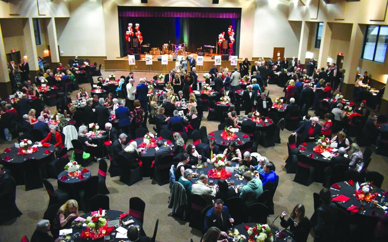 Enoch Autry/The Clayton Tribune. More than 300 attended the 24th annual Sweetheart Ball in the Rabun County Civic Center on Feb. 10. The festive night included a catered meal, a silent auction, live auction, live band and dancing. Left: Jim Roberson dances with his wife Susan to the live music played by the band Party At The Limit. Susan Roberson is a F.A.I.T.H. Board of Directors member. The Feb. 10 Sweetheart Ball raised $100,000.