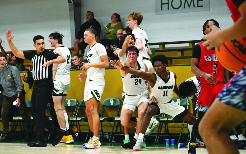 Wade Cheek/The Clayton Tribune. RGNS boys Andria Siamashvili and Roldjudson Lacossade react to the victory.