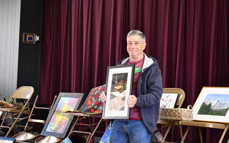 Megan Horn/The Clayton Tribune. Mark Barton was inspired by the film “Days of Wine and Roses” for his art piece.