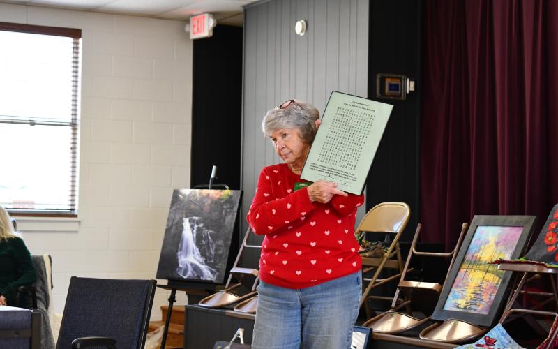 Megan Horn/The Clayton Tribune. Kathy Ford chose the movie “The Magnificent Seven” as her inspiration for unique word searches that incorporate her grandchildren and reveal pop culture information in clever ways once words are found.