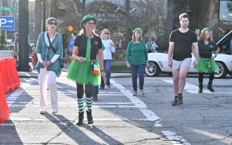 Megan Horn/The Clayton Tribune. Neon Embers entertained the block party crowd by performing an Irish Jig. The group also taught line dancing to many people at the event.