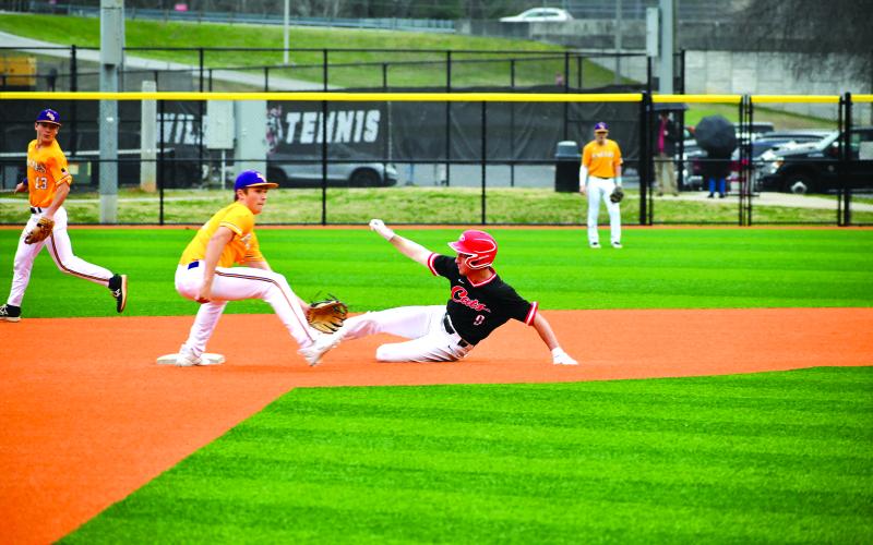 Wade Cheek/The Clayton Tribune. Diamond Wildcat senior Jarret Giles slides into second base safely to collect a stolen base against Athens Christian on Tuesday, March 5. Rabun County, however, lost 15-3 to the region foe Eagles.
