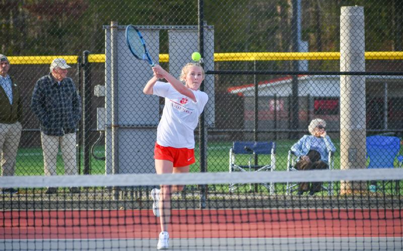 Wade Cheek/The Clayton Tribune. Lady Cats’ No. 1 singles player senior Abby Sego watches her shot. Sego has held down the RCHS top spot since her freshman year.
