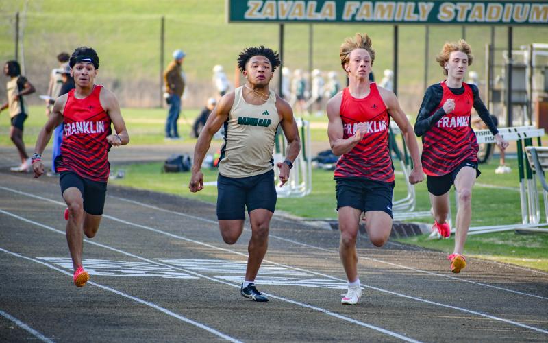 Wade Cheek/The Clayton Tribune. RGNS senior and Eagles running back Tyrell Campbell sprints to the finish-line against a Franklin (NC) runner during the boys 100 meters.