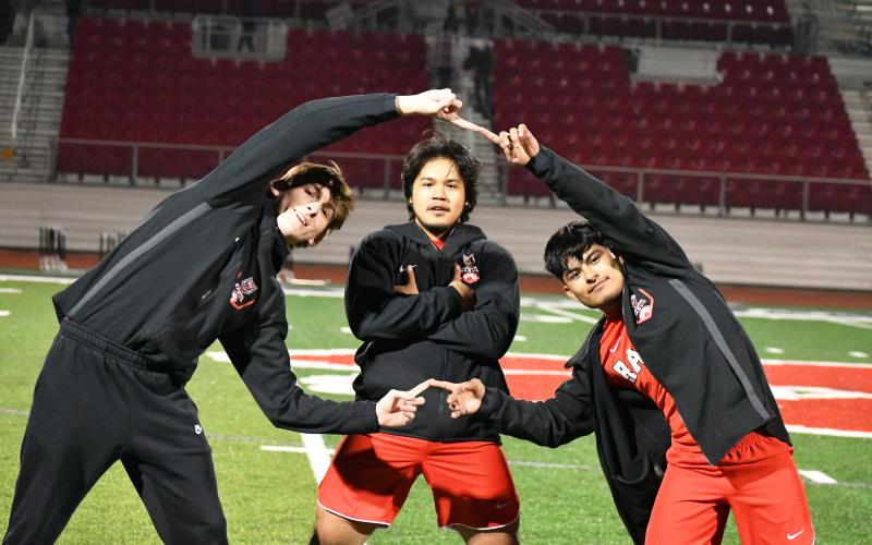 Wade Cheek/The Clayton Tribune. RCHS soccer seniors Jack Vepraskas, Luis Lopez Silva and Moises Figueroa strike a pose in celebration of their 10-0 victory over Athens Christian on Tuesday, March 19.