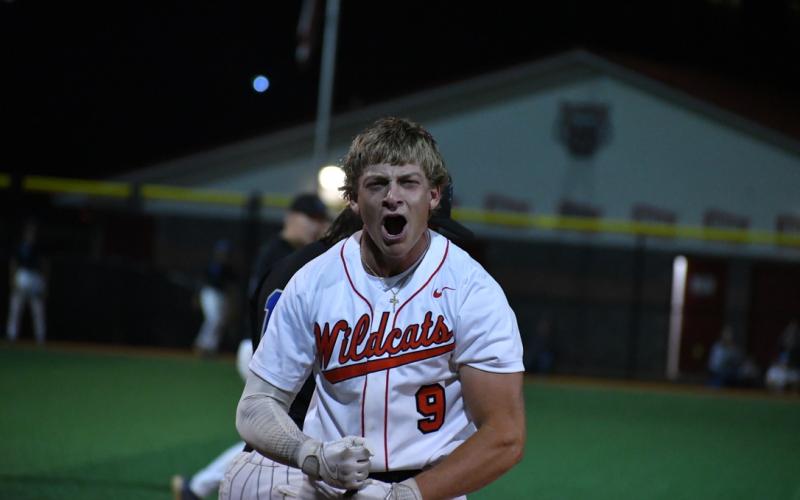 Wade Cheek/The Clayton Tribune. Wildcat senior Jarret Giles celebrates a triple during the RCHS baseball team's final game of 2024 against Towns County on Friday, April 19.