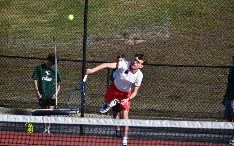 Wade Cheek/The Clayton Tribune. Wildcat Robbie Fountain serves.