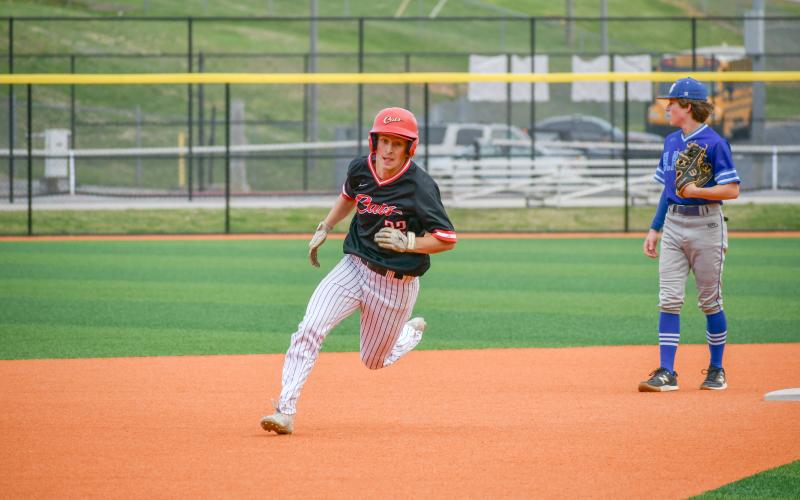 Wade Cheek/The Clayton Tribune. Wildcat junior outfielder Carver Jarrard sprints to third base during Rabun County’s 8-1 region win over BASA on Monday, April 8.