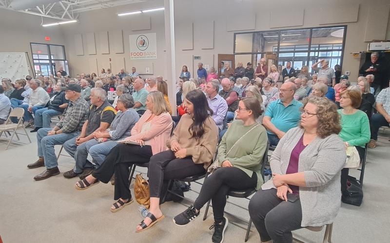 Megan Horn/The Clayton Tribune. It was standing room only in the Food Bank of Northeast Georgia Community Room April 11 as over 100 people attended a question and answer forum for Board of Commissioner and Clerk of Court candidates, co-hosted by Rabun County Republicans and The Clayton Tribune with Publisher Enoch Aury moderating.