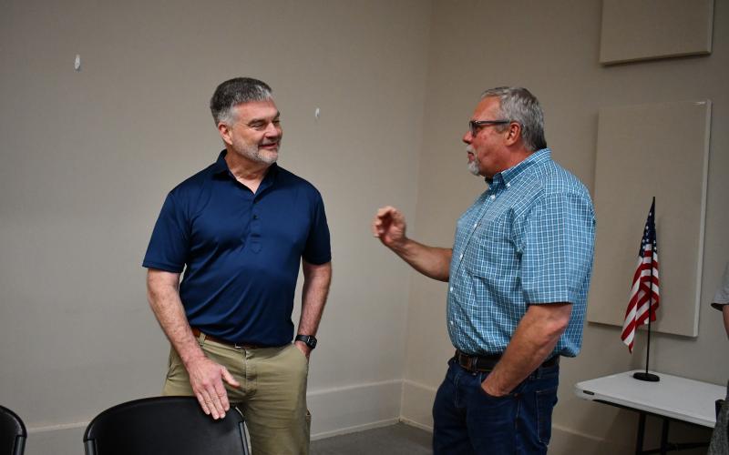 Megan Horn/The Clayton Tribune. Rep. Victor Anderson, left, converses with Rabun County Commissioner Tom Garrison during the April 11 forum.